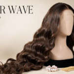 Mannequin head displaying a long brown water-wave wig with a smooth, glossy finish; brush and hair tie nearby.