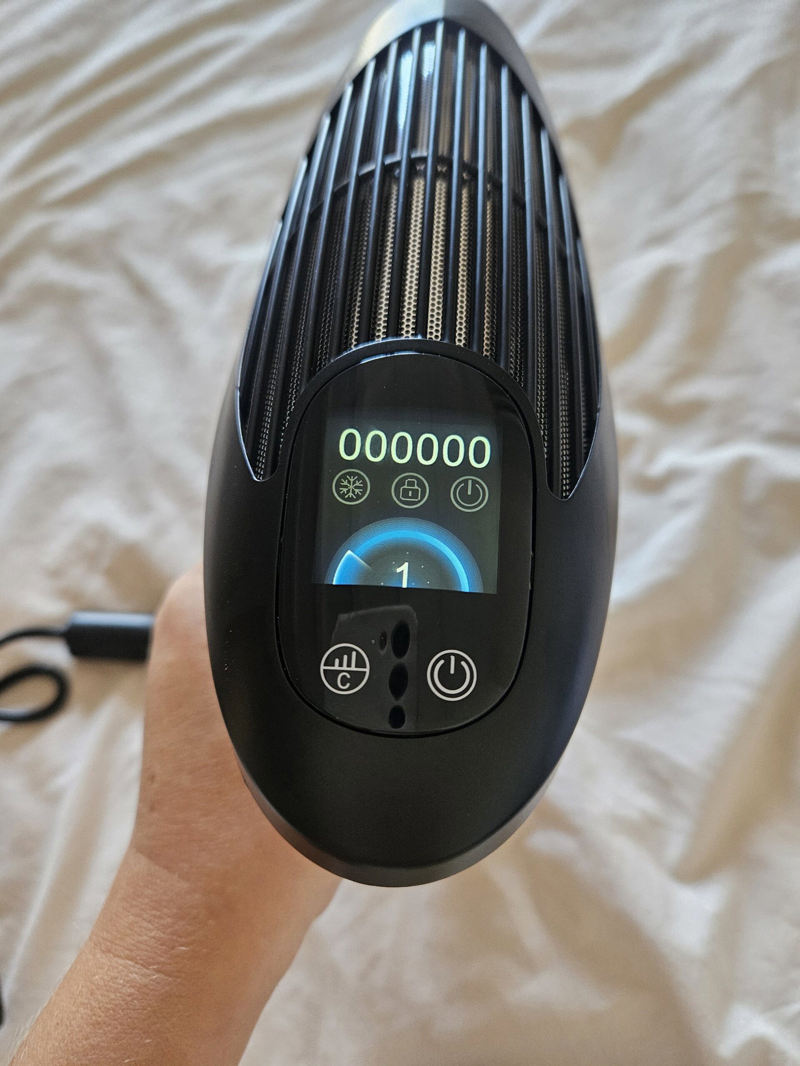 ViQure S-LD Hair Removal Device LCD display showing treatment controls and pulse counter
