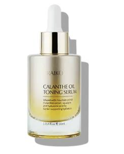 Glass dropper bottle of toning serum with yellow oil and a gold cap on a white background.