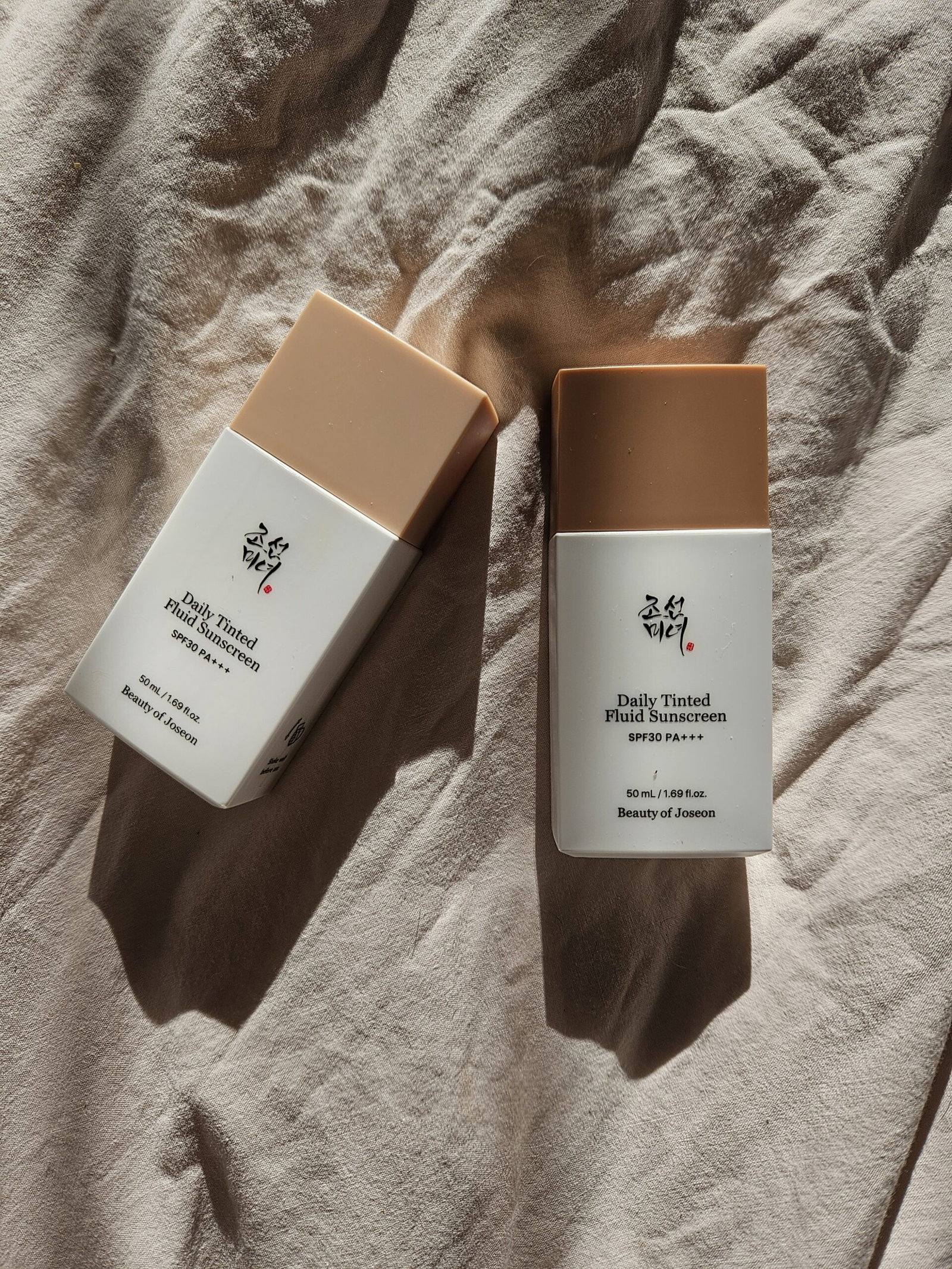 beauty-of-joseon-daily-tinted-fluid-sunscreen-bottles | Live That Glow Two bottles of Beauty of Joseon Daily Tinted Fluid Sunscreen SPF 30 in different shades