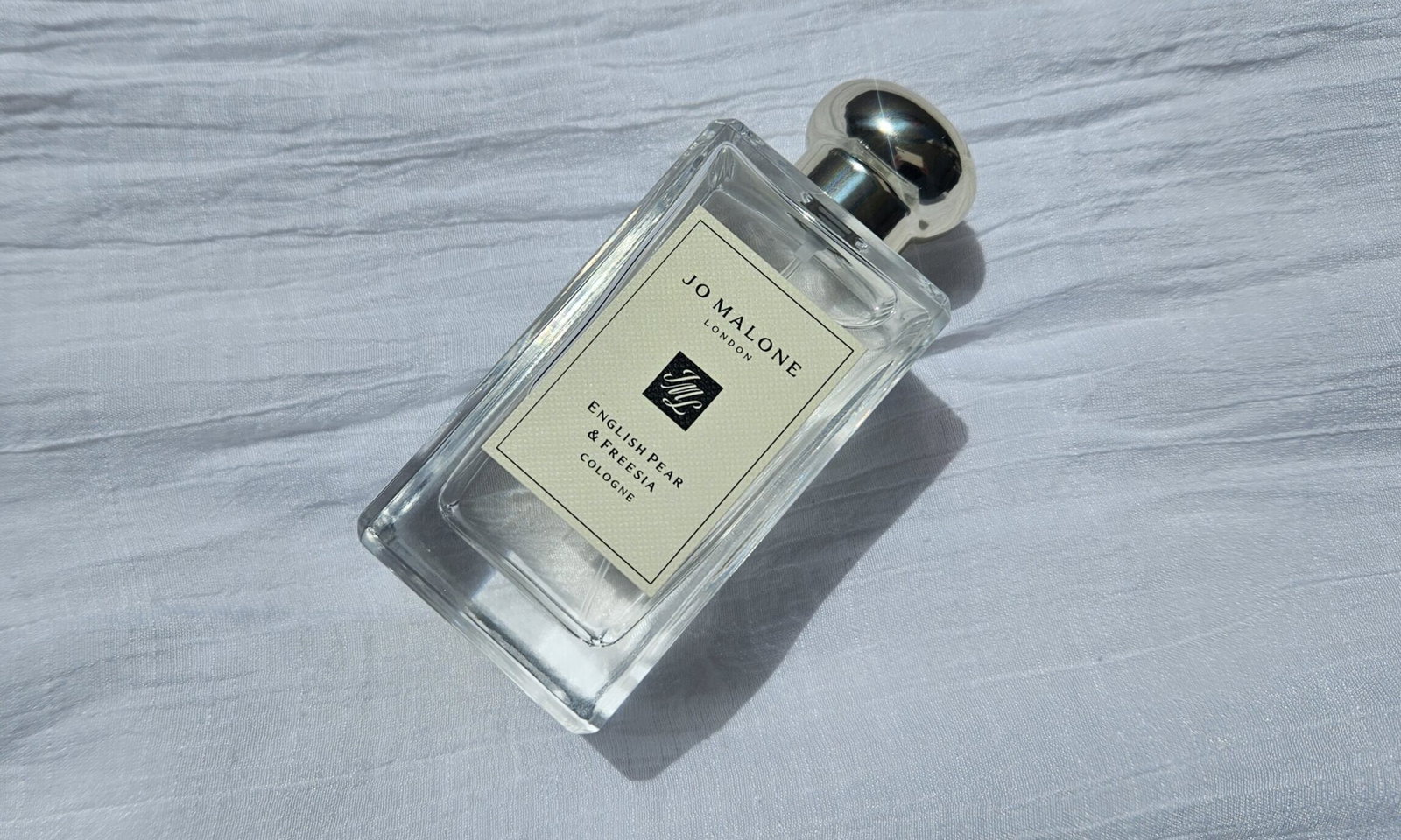 Jo Malone London English Pear & Freesia Cologne bottle photographed during our review
