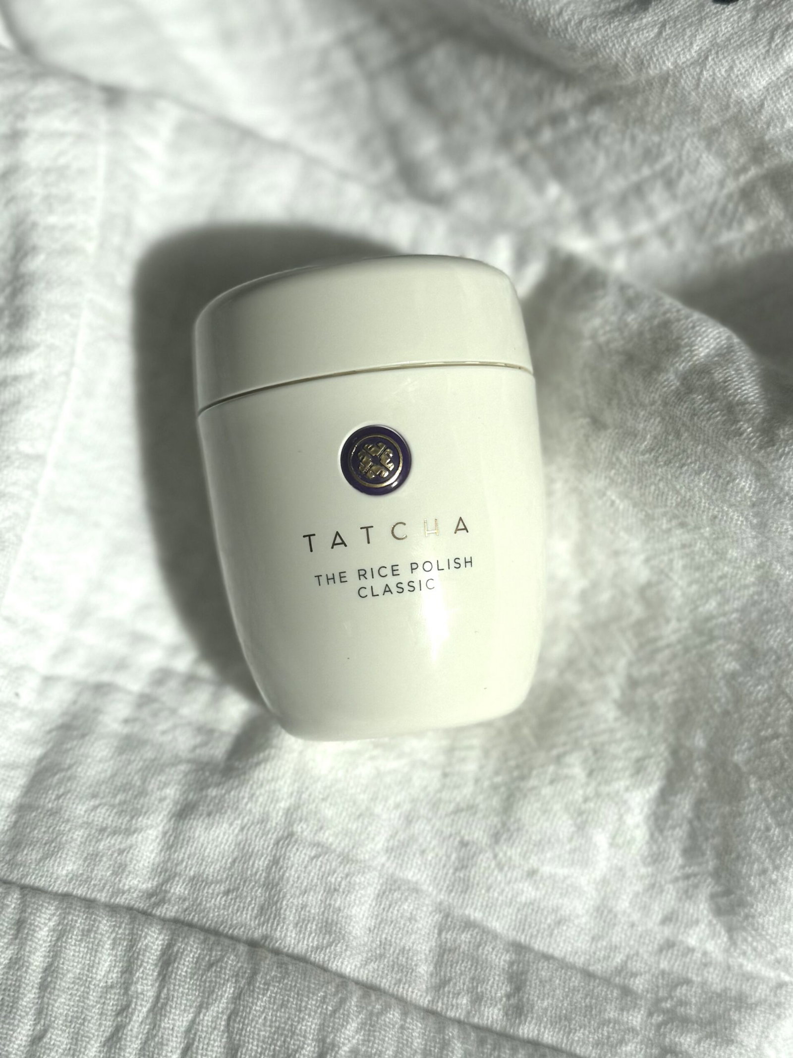 tatcha-rice-polish-classic | Live That Glow Tatcha The Rice Polish Classic exfoliating powder on white fabric