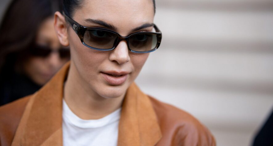 Kendall Jenner wearing sunglasses with glowing skin