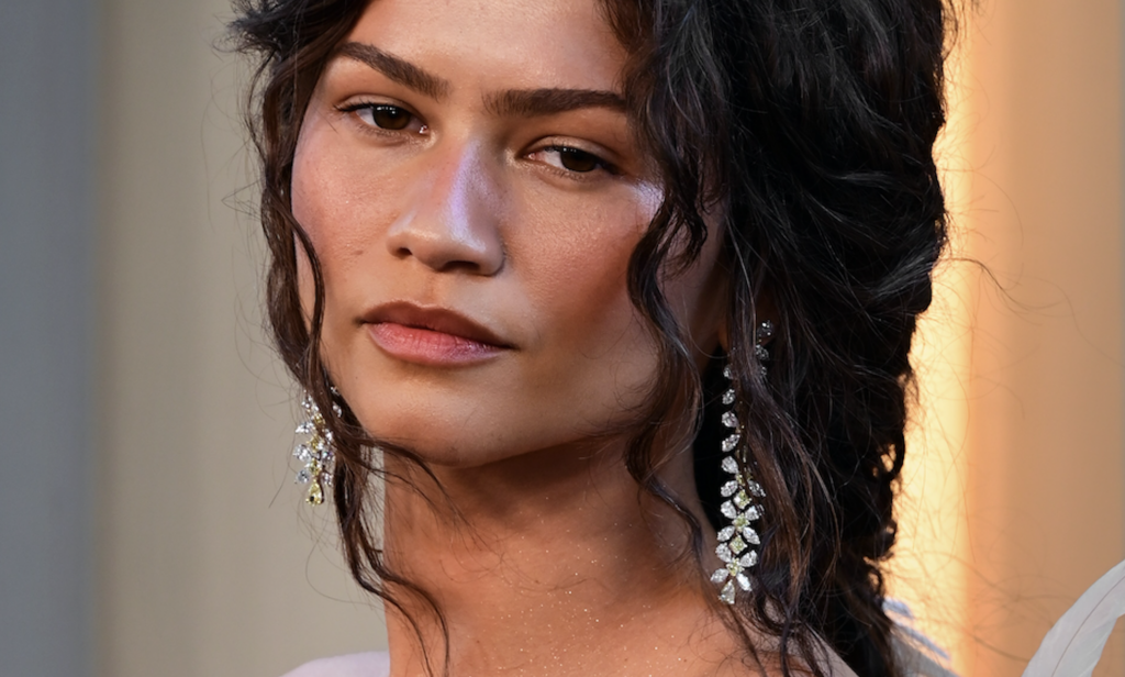 Zendaya wearing warm, softly coordinated eye, cheek and lip makeup for a pulled-together look.