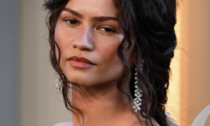 Zendaya wearing warm, softly coordinated eye, cheek and lip makeup for a pulled-together look.