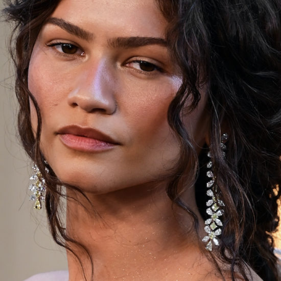 Zendaya wearing warm, softly coordinated eye, cheek and lip makeup for a pulled-together look.