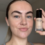 Alice wearing and holding DCYPHER Natural Custom Foundation