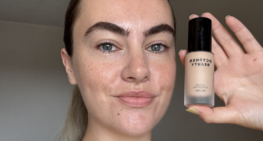 Alice wearing and holding DCYPHER Natural Custom Foundation