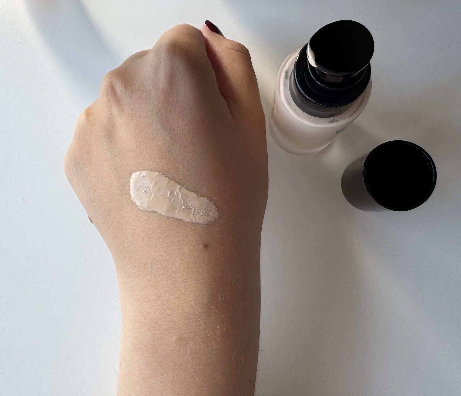 Swatch of DCYPHER Natural Custom Foundation on the back of a hand
