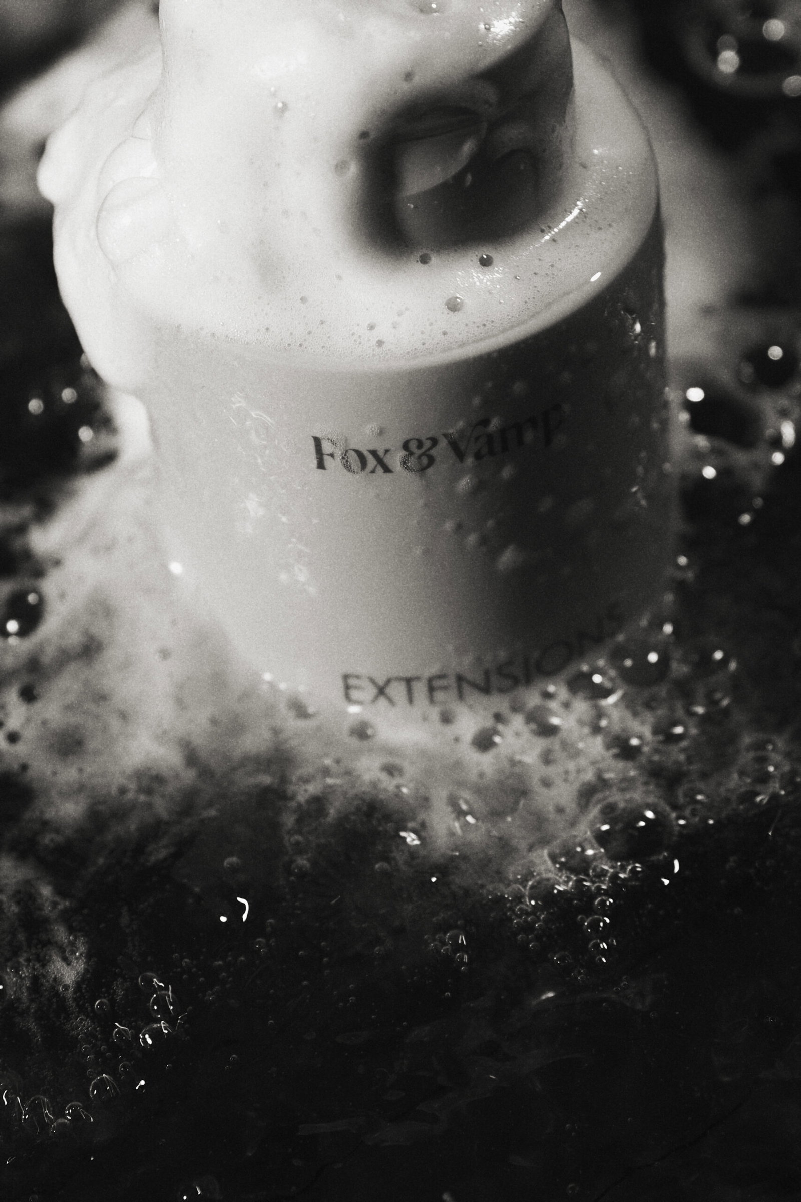 Fox & Vamp hair extension aftercare product being washed with water