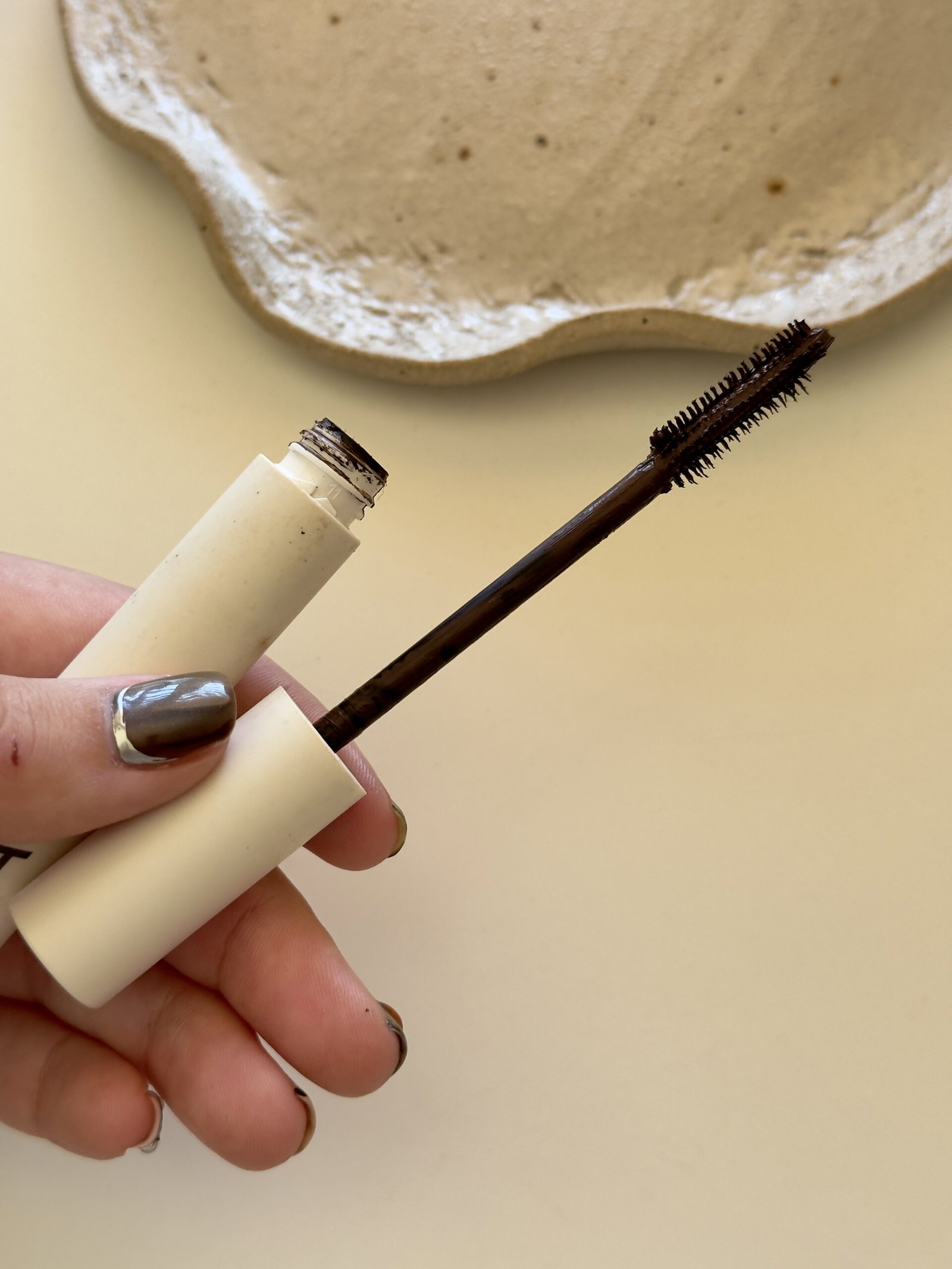 ILIA Limitless Lash Mascara in brown with the mascara wand removed