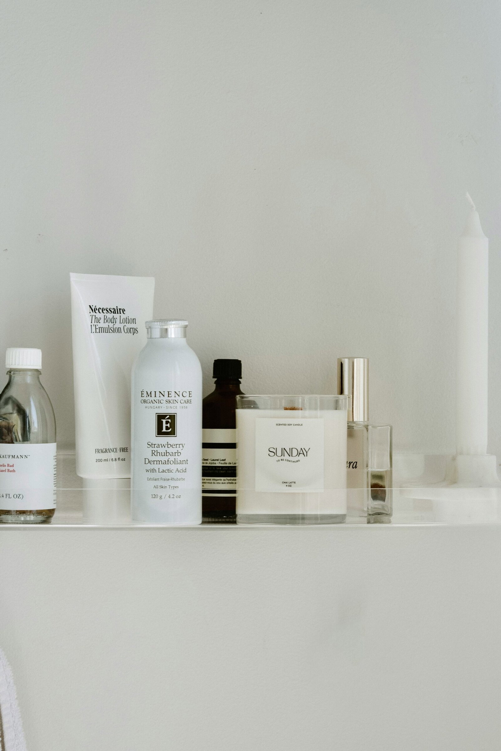 wellness-self-care-products-bathroom-shelf | Live That Glow Wellness and self-care products arranged on a bathroom shelf