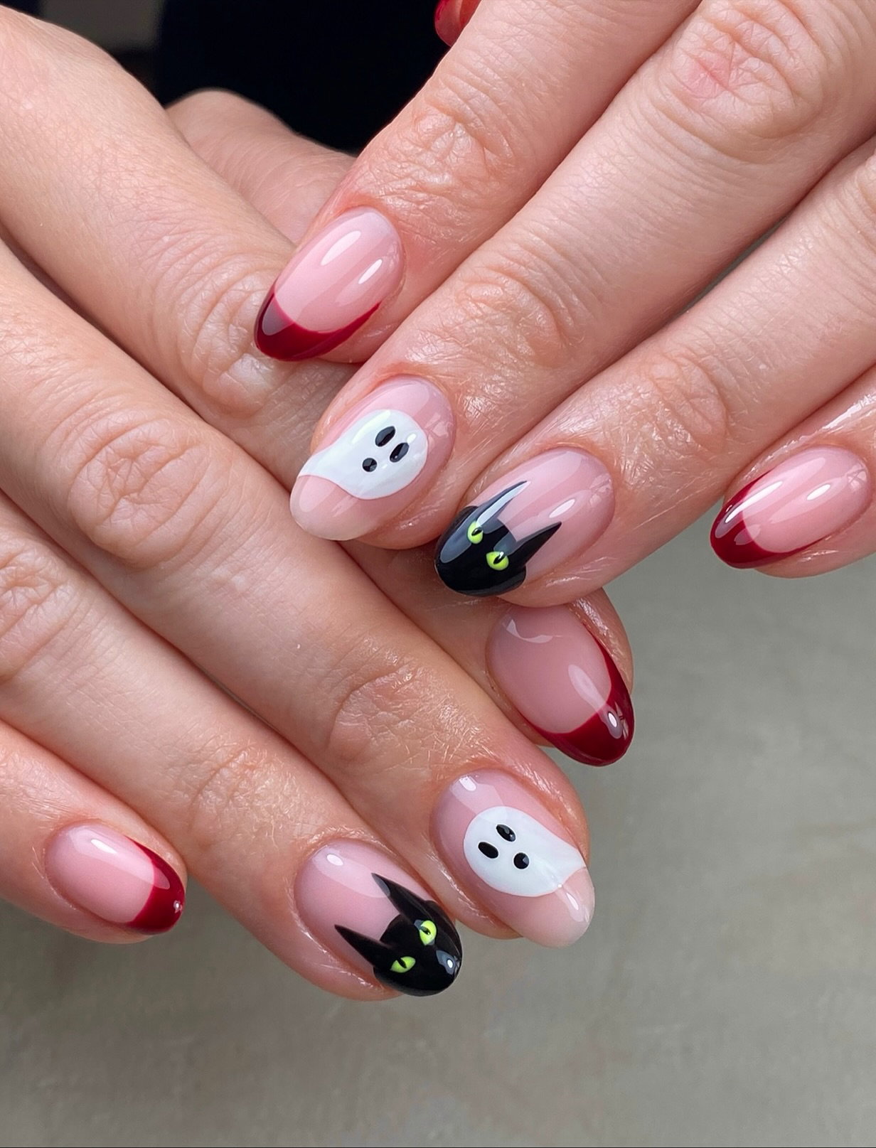 Almond French tip nails in orange, yellow and soft autumnal shades.