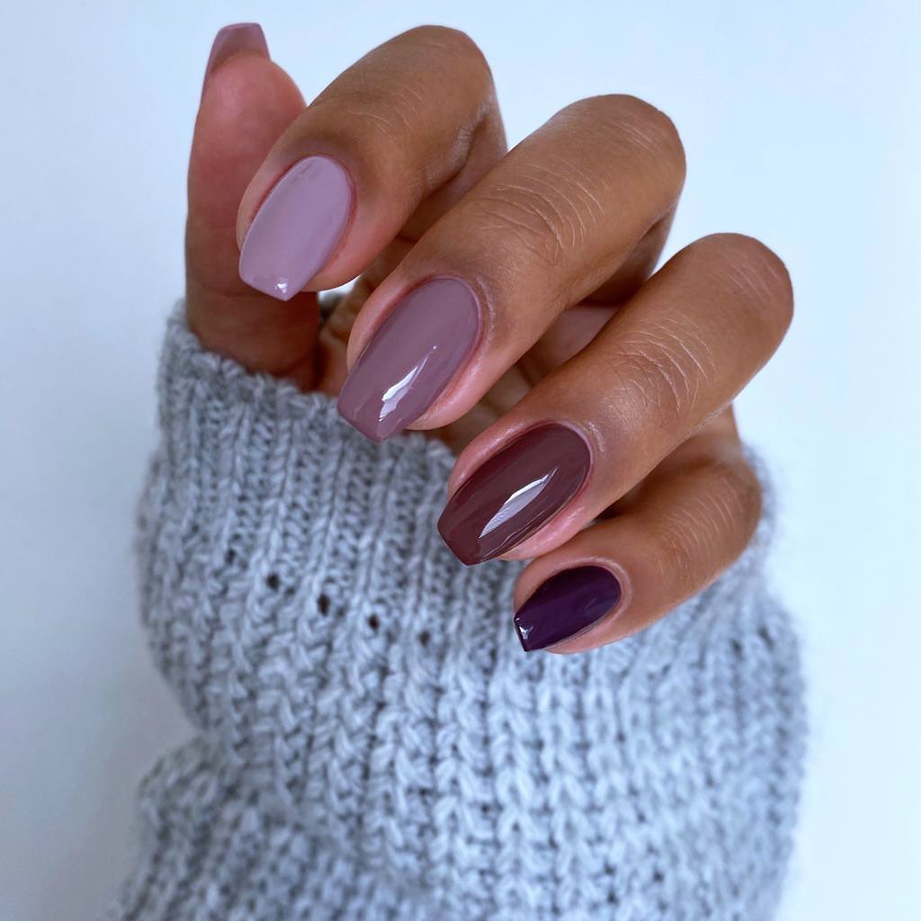 Purple autumn nails in graduated lilac, mauve, plum and deep purple shades.
