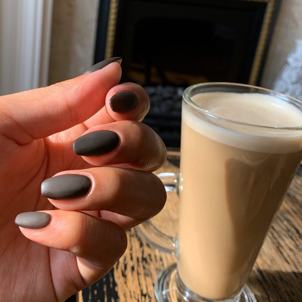 Short matte brown nails in a deep coffee shade for a simple autumn manicure.