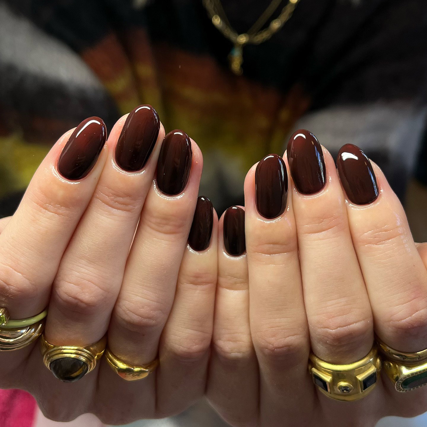 Glossy chocolate brown nails for a classic autumn manicure.