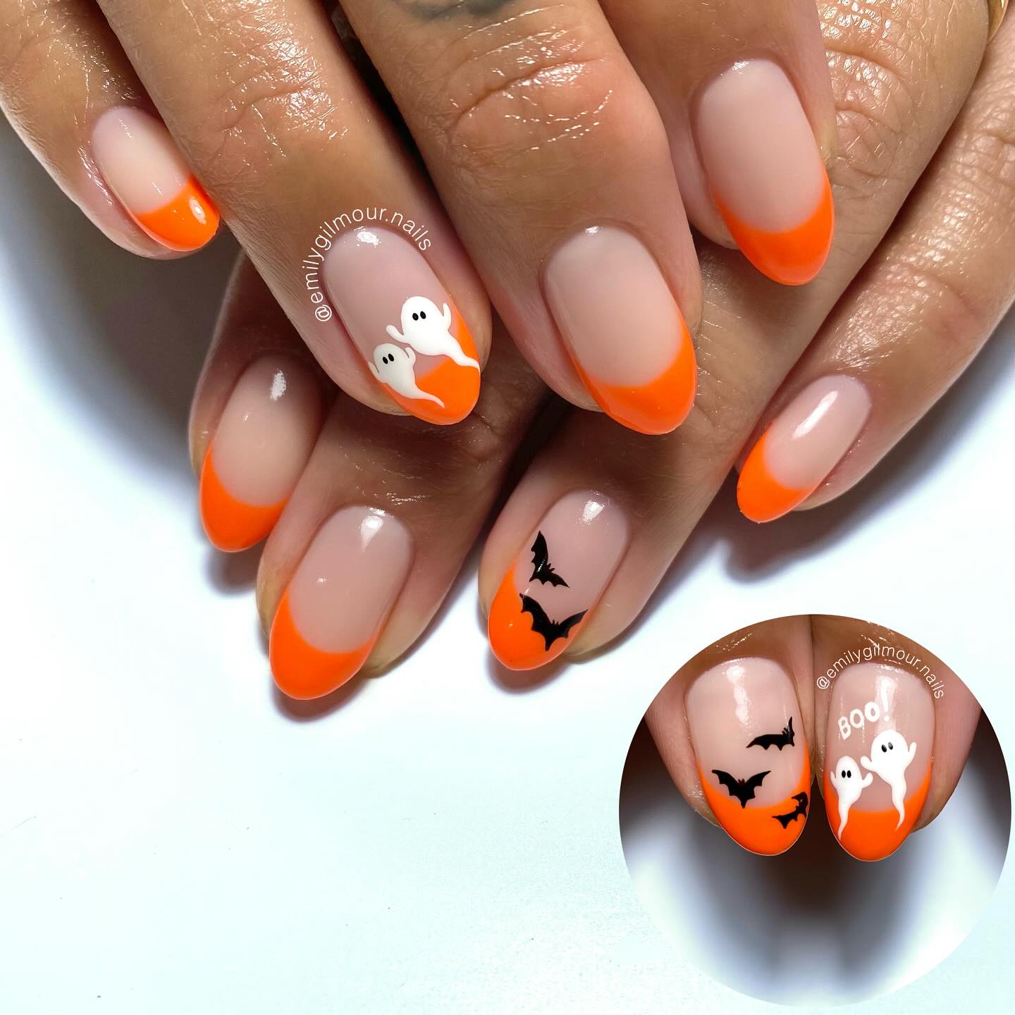Orange Halloween French tip nails with playful seasonal nail art.