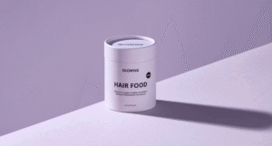 GLOWWA Menopause Hair Food supplement in a lilac 60-capsule container against a purple background with a long diagonal shadow.
