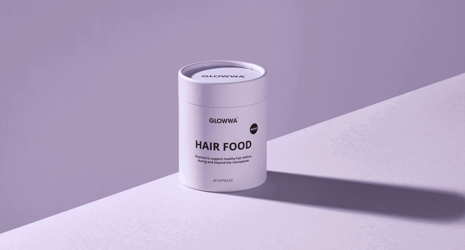 GLOWWA Menopause Hair Food supplement in a lilac 60-capsule container against a purple background with a long diagonal shadow.