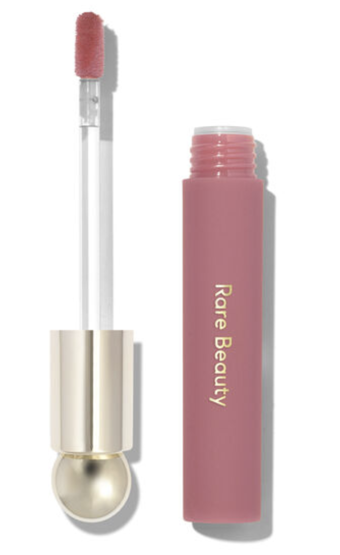 Rare Beauty Soft Pinch Tinted Lip Oil in Hope with its pink-coated applicator beside the open bottle.