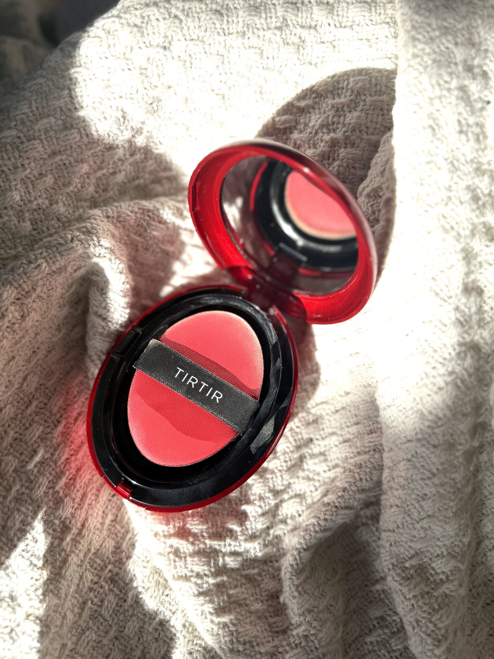 TirTir Mask Fit Red Cushion foundation compact held in hand